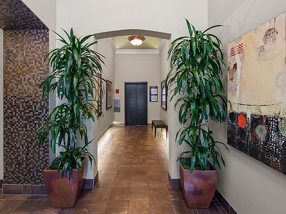 Beautiful lobby leads to mail room, stairs, and elevator