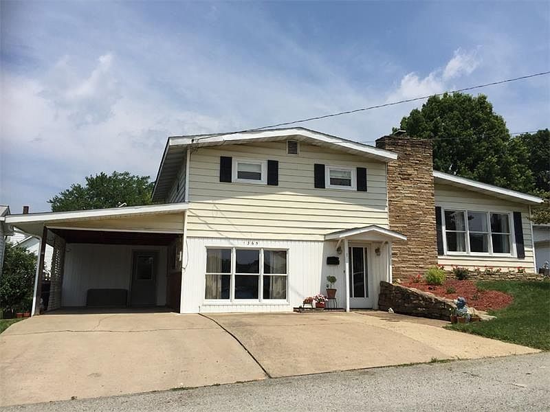 Front; carport, double-wide concrete driveway