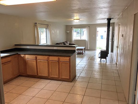 From the open kitchen back towards main room