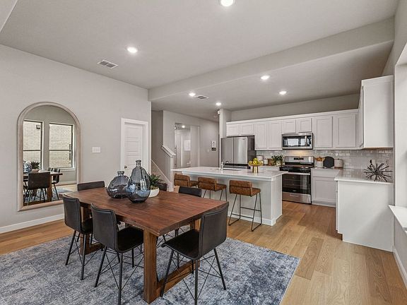 Dining Room in the Stanley II home plan by Trophy Signature Homes - REPRESENTATIVE PHOTO