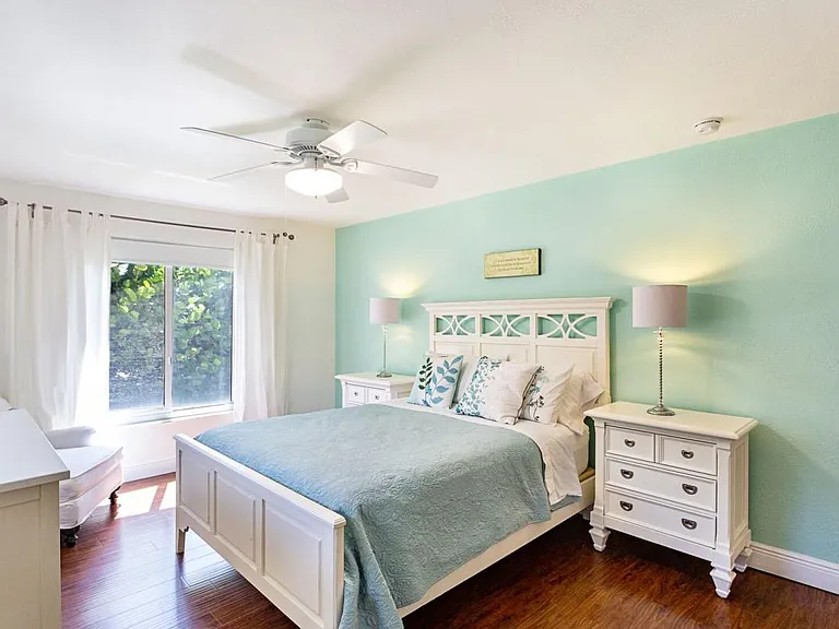 Third bedroom with view of window