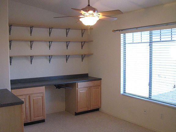 Office/Den with built in cabinets and shelving