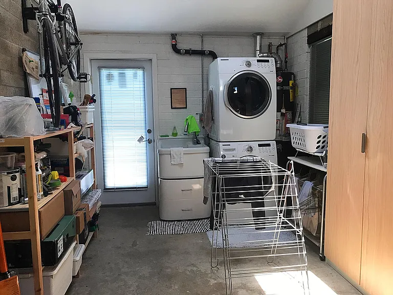 laundry and utility area in attached finished garage