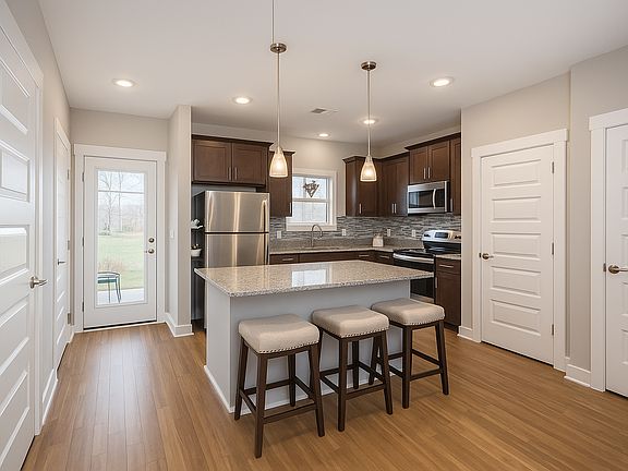 The modern kitchen is equipped with all necessary appliances and cookware needed.