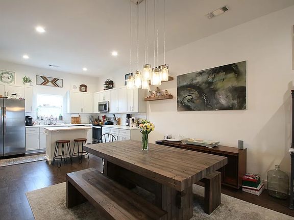 Open dinner and kitchen space (picture showing table and benches that seat 6).