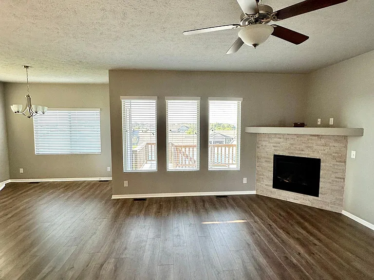 Living room with back deck through windows