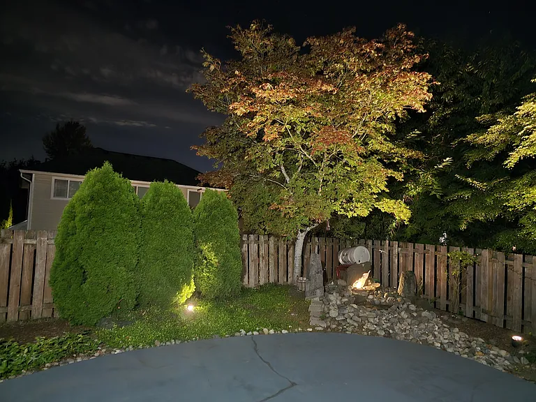 Backyard night view with automatic timer based lights