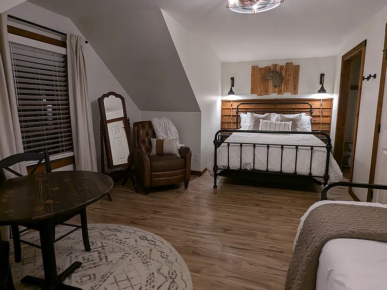 UPSTAIRS BEDROOM 2 (sleeps 4 total): Queen Bed and Twin Daybed with Pop-Up Twin Trundle.