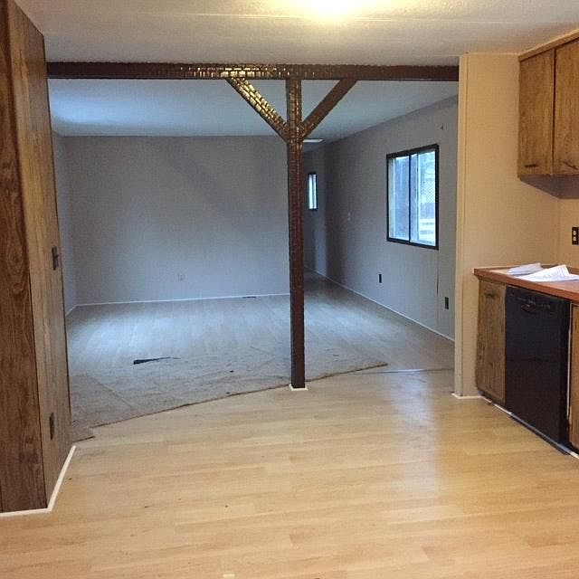 Open living room and kitchen with hardwood floors