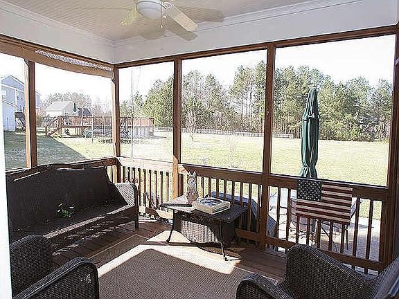 Enjoy The Outdoors In Your Screened Porch. Porch Opens to Nice Size Patio