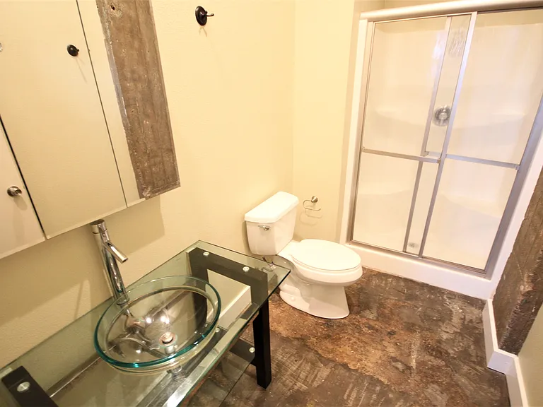 Bathroom typical with italian lavatory and shower with glass door