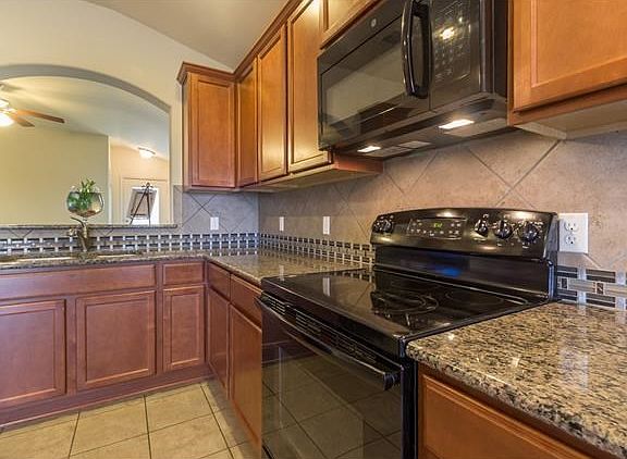 Beautiful custom tile work and glimmering granite counter tops