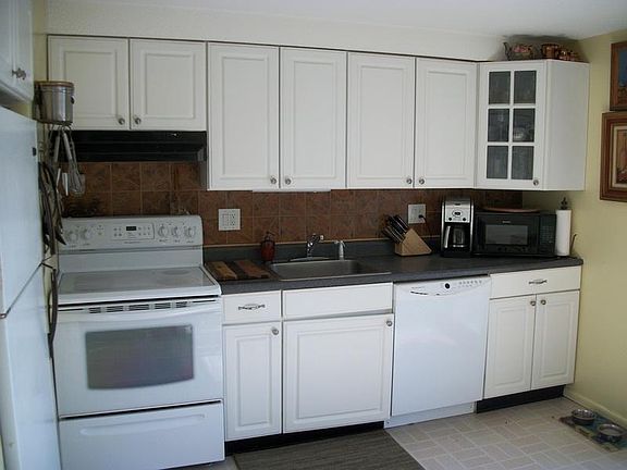 Bright Updated Kitchen with Sliders to Large
        Deck