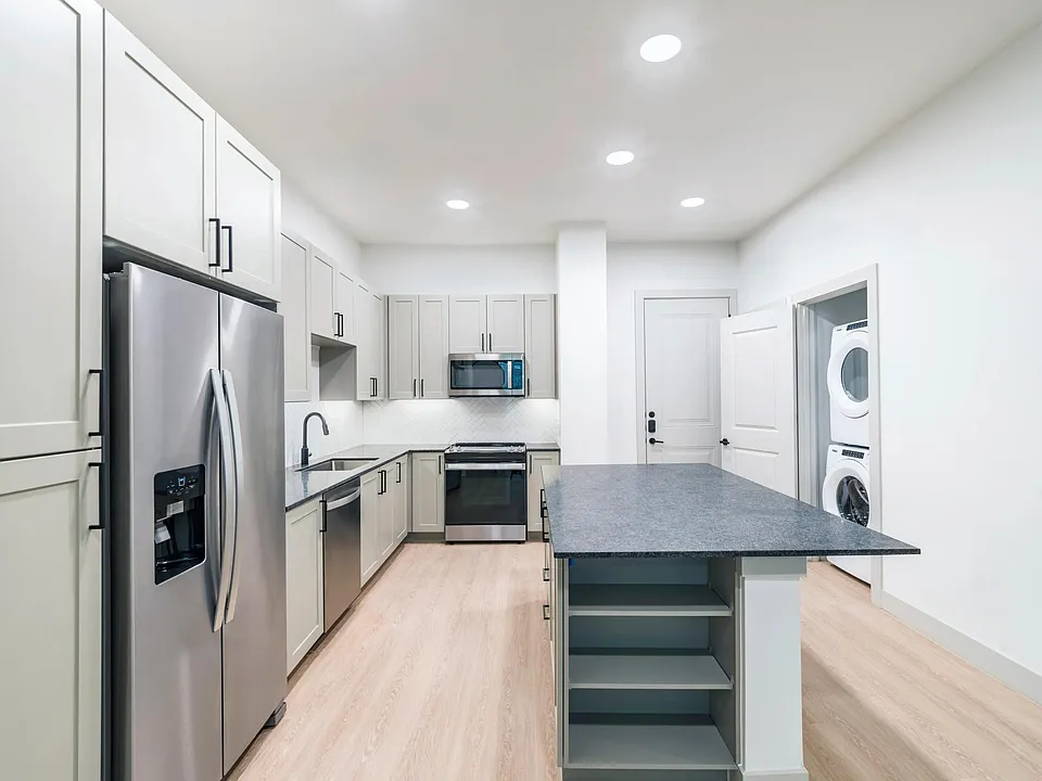 Take advantage of ample storage options including dedicated pantry and in island shelving.