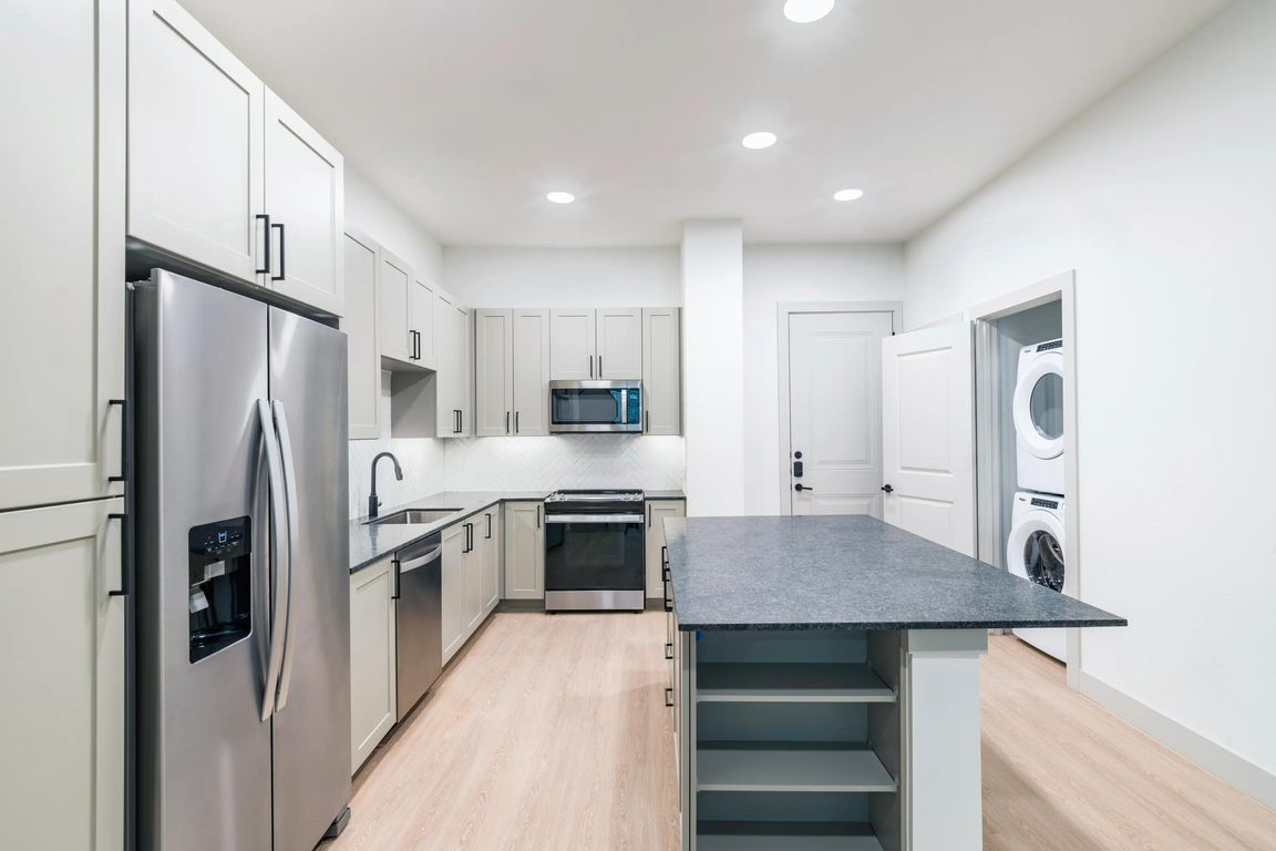 Take advantage of ample storage options including dedicated pantry and in island shelving.