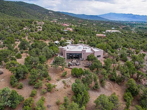 Aerial of north side of house looking south, showing some of the property's 3 acres that borders National Forest land