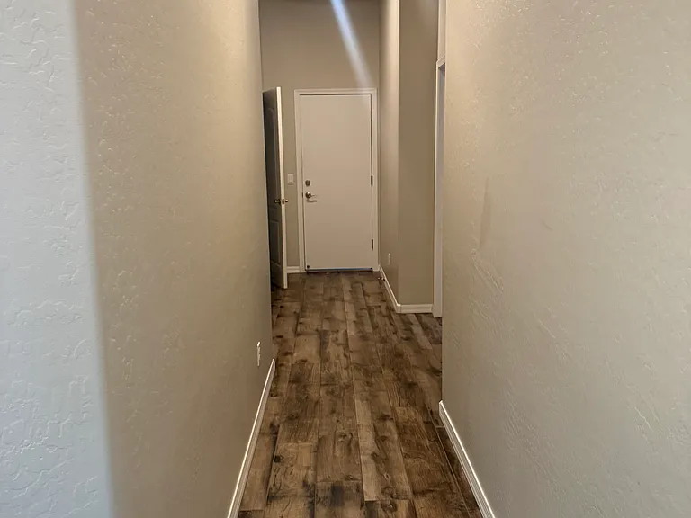 Hallway leading to 2 BR, 1 BA & 3rd-car garage (left wing of house)