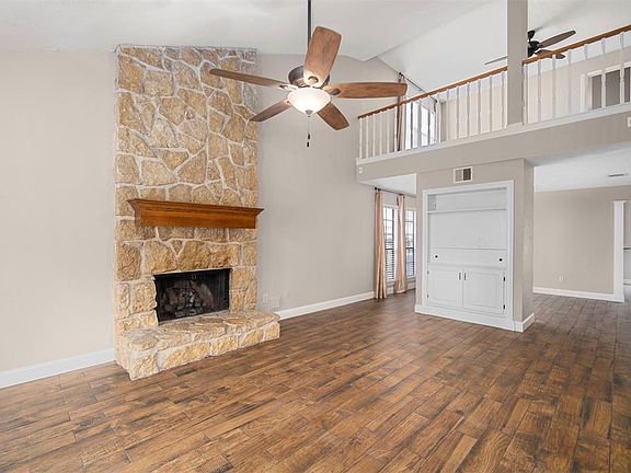 You are invited into a beautiful living room with high ceilings, which leads into a dining area! Home has ample natural light.