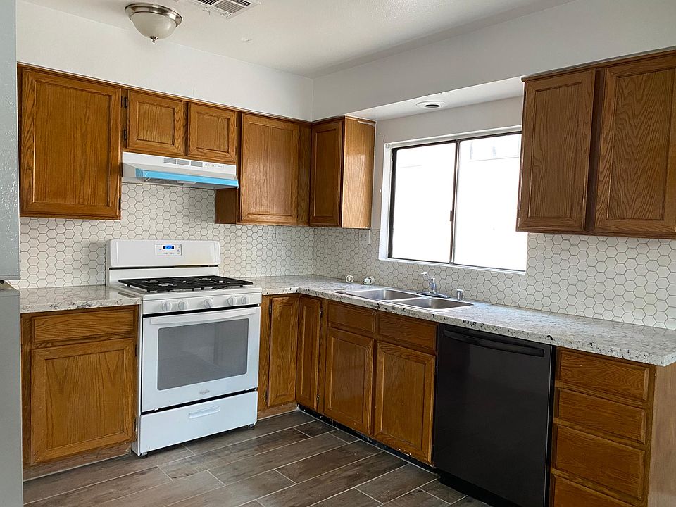 New tile flooring, new blinds, new stove vent, new granite countertop & new mosaic backsplash