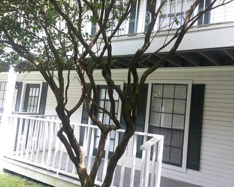 Front of townhouse notice porch on second floor from bedroom