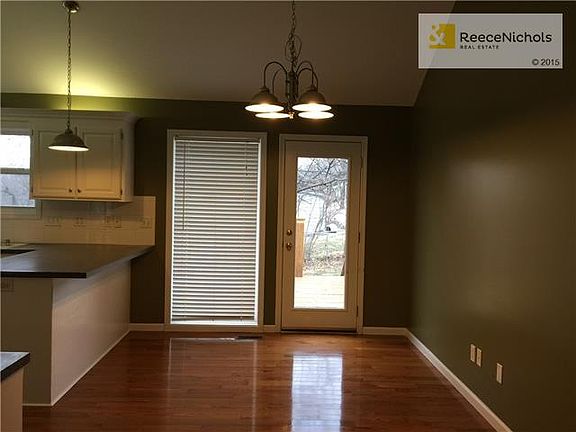 Breakfast Bar/Peninsula, Wood Floors, new fixtures.  Walk out to Deck and Fence Backyard.