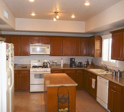 Kitchen with granite and recessed lighting