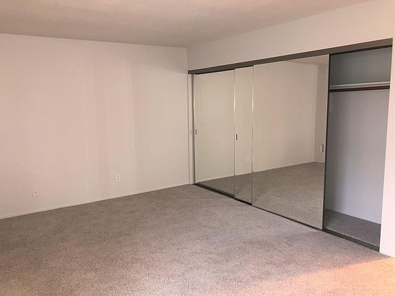 Master Bedroom w/ mirror closet.