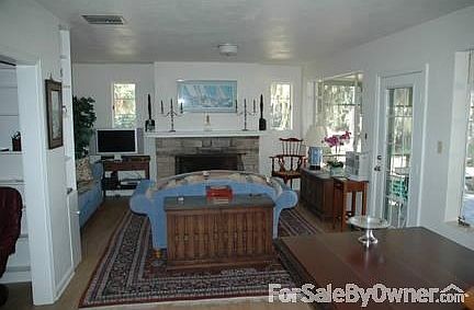Living/Dining Room and Fireplace
						:
						Rooms are accessed from kitchen or hall. Built in bookshelves create an alcove.