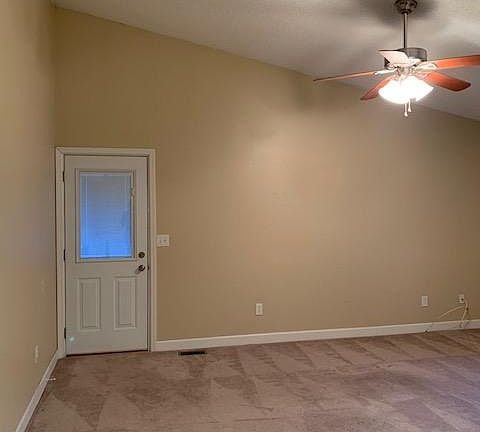 Updated Side Door with built in blinds. Vaulted Living Room