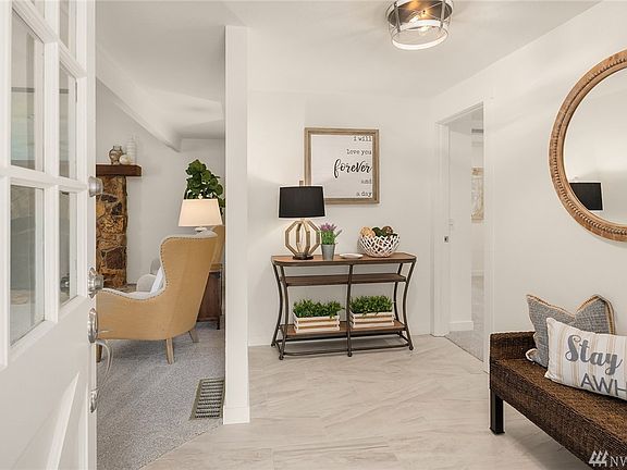 Inside you will find light filled rooms that have recently been reimagined. The entry has been expanded and offers new tile.