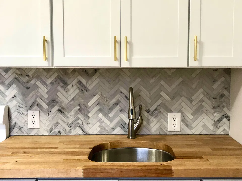 marble herringbone backsplash