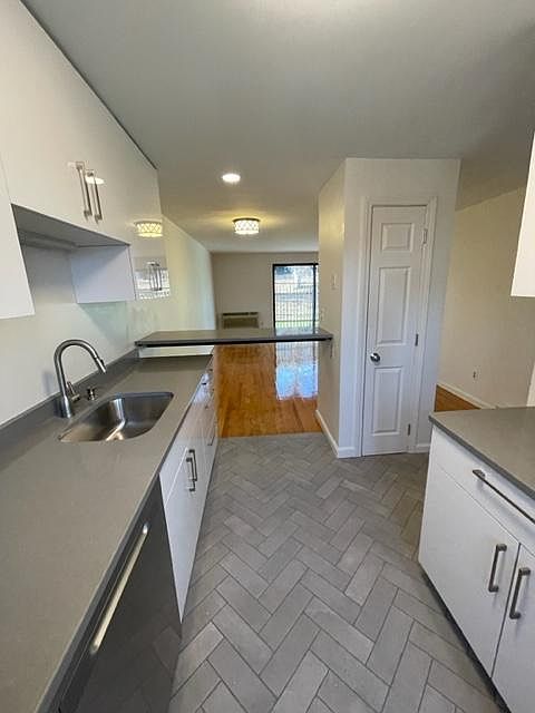 Kitchen looking into living room