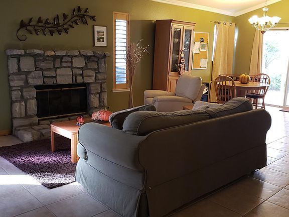 The front living room includes a built-in gas fireplace and vaulted ceilings. The dining room is spacious and has an open feeling.