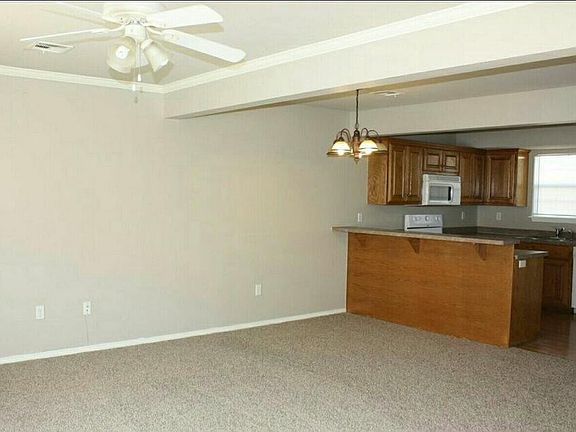 Living room and dining area with breakfast bar