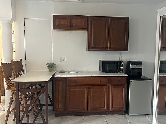 Kitchenette (Microwave, Air-fryer, Mini fridge now but 7.5 cu. ft. fridge will be installed soon and a 2 burner table top).