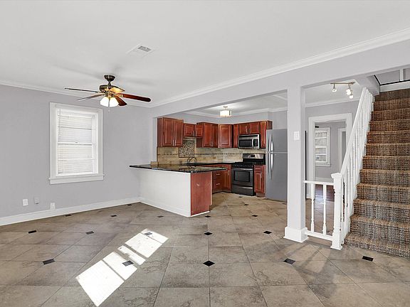 Large open design kitchen with stainless steel appliances