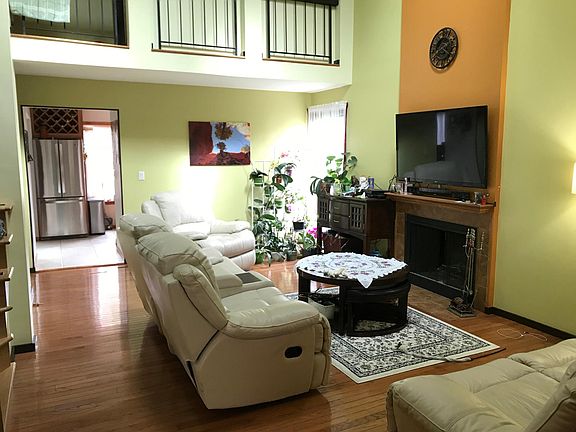High celling Living room with fireplace