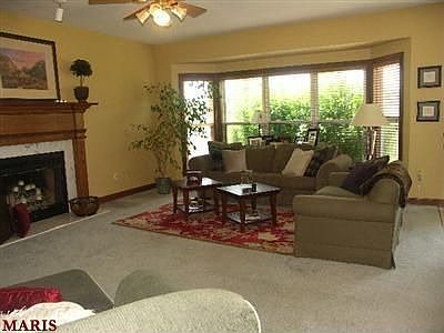 Living room w/bay window and fireplace