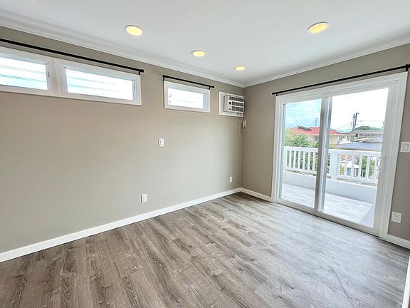 1st bedroom on second floor with lanai and closet.