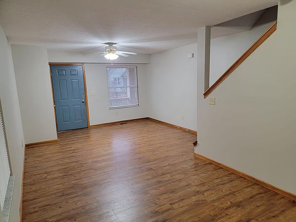 Main room 1st floor looking toward front door and window