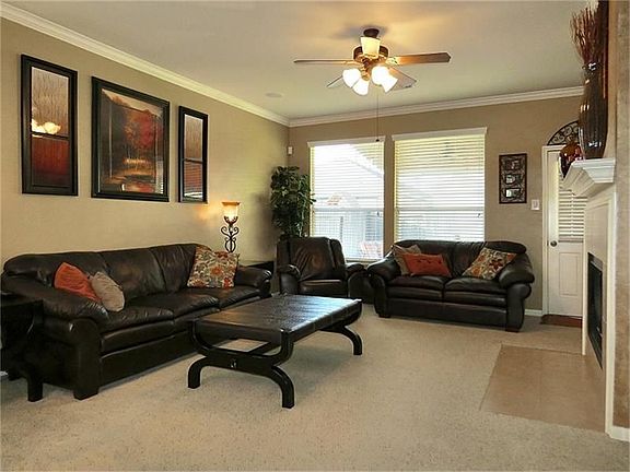 Open living area with easy egress to covered patio ...