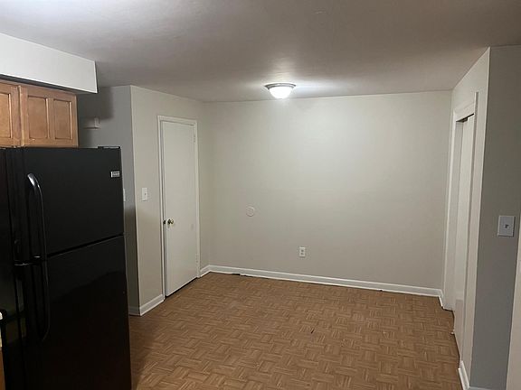 Dining area next to kitchen with two closets