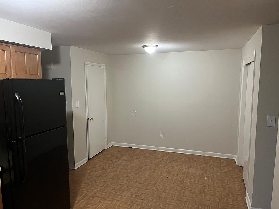 Dining area next to kitchen with two closets