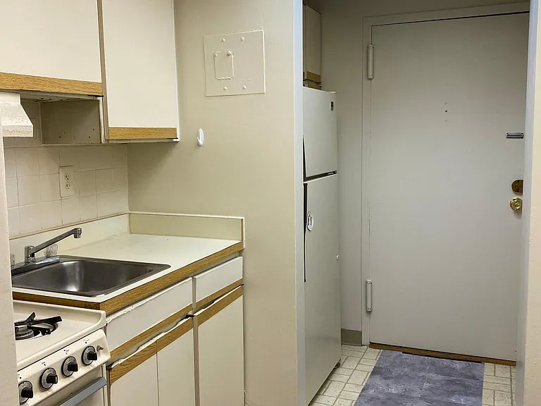 The entrance is through the kitchen.