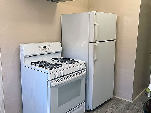 Kitchen stove, oven and refrigerator close up