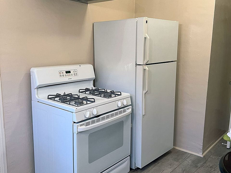 Kitchen stove, oven and refrigerator close up