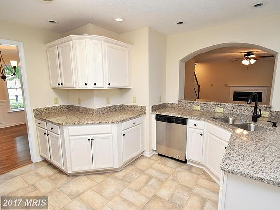 Open and Bright Kitchen with White Cabinets