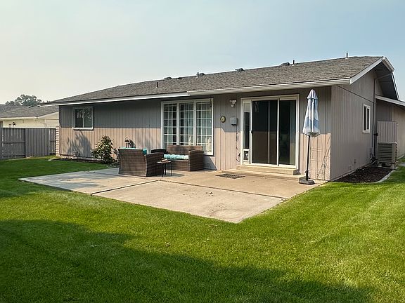 Back yard and patio. Slider leads from kitchen dining to patio.