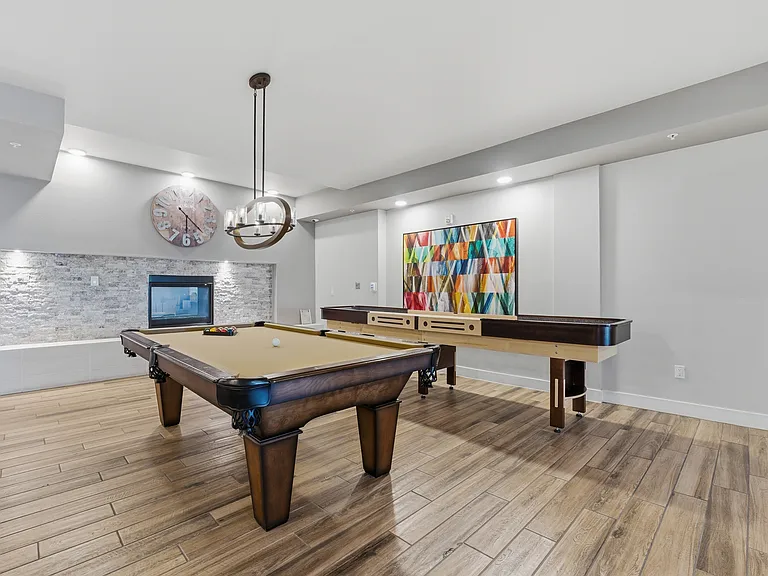 Enjoy a dedicated billiards and shuffleboard lounge located right inside the luxury clubhouse.