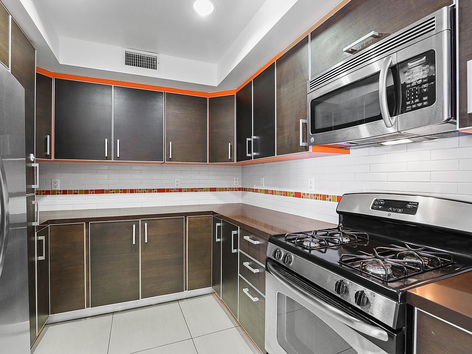 Full-Size Kitchen with Energy-Efficient Appliances and Ample Cabinet Storage